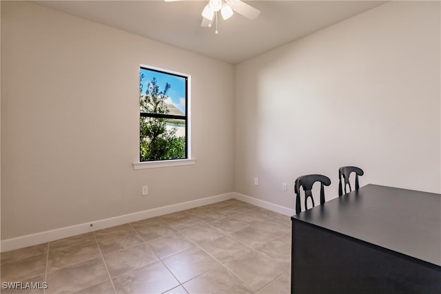 unfurnished office with light tile patterned flooring and ceiling fan