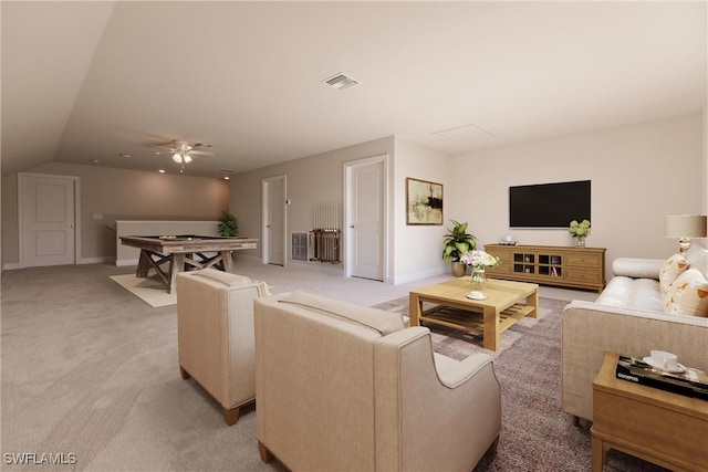 carpeted living room featuring ceiling fan and lofted ceiling