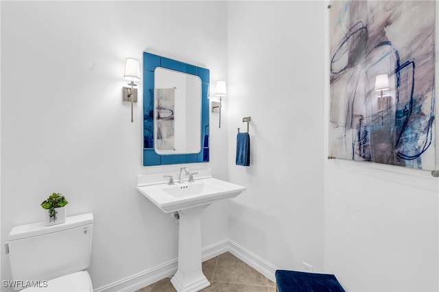 bathroom with tile patterned floors and toilet