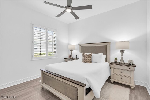 bedroom featuring light hardwood / wood-style flooring and ceiling fan