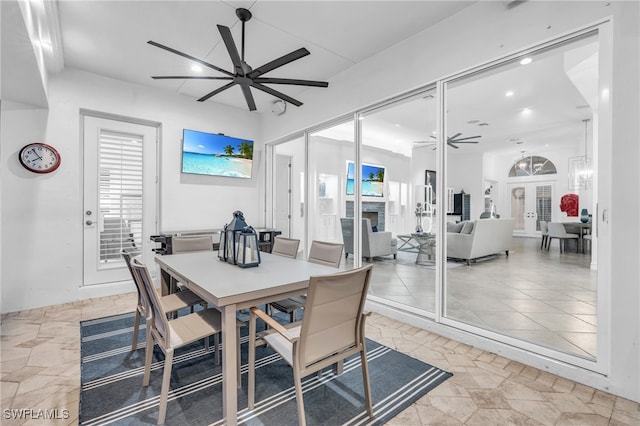 dining area featuring ceiling fan and french doors