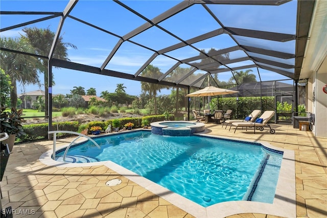 view of pool with glass enclosure, a patio area, and an in ground hot tub