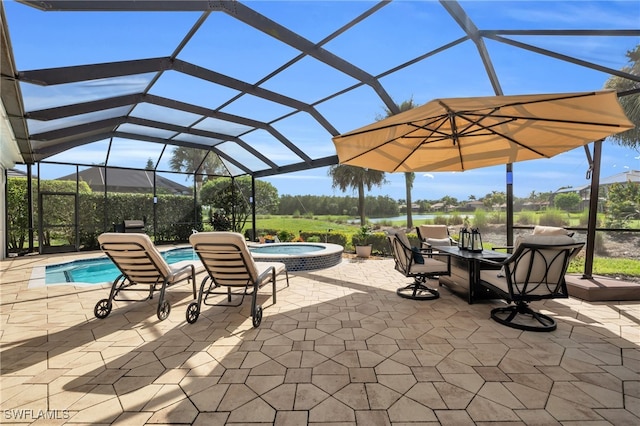 view of patio featuring a swimming pool with hot tub and glass enclosure