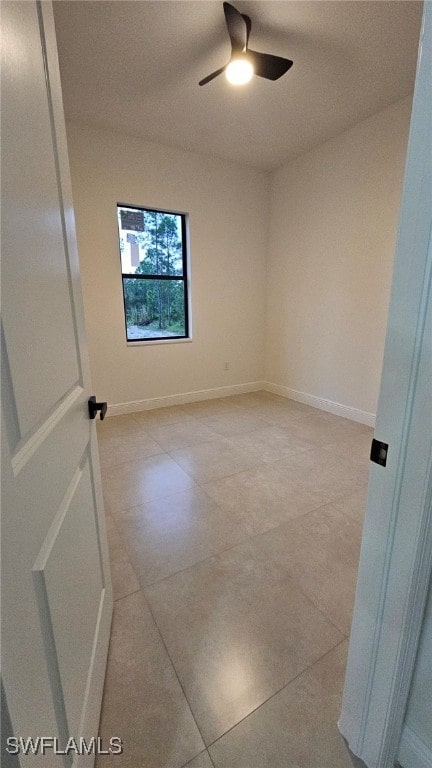 unfurnished room with ceiling fan