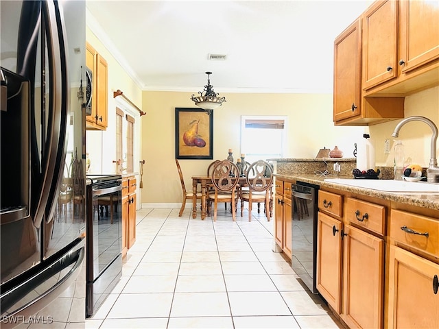 kitchen featuring sink, pendant lighting, light tile patterned floors, black appliances, and ornamental molding