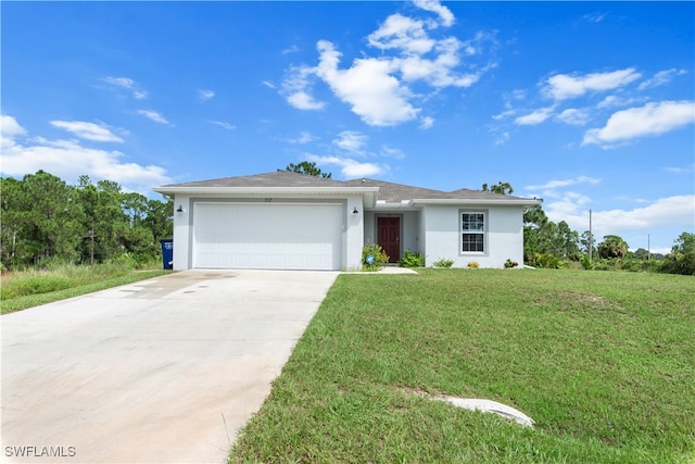 view of front of home featuring a garage and a front lawn