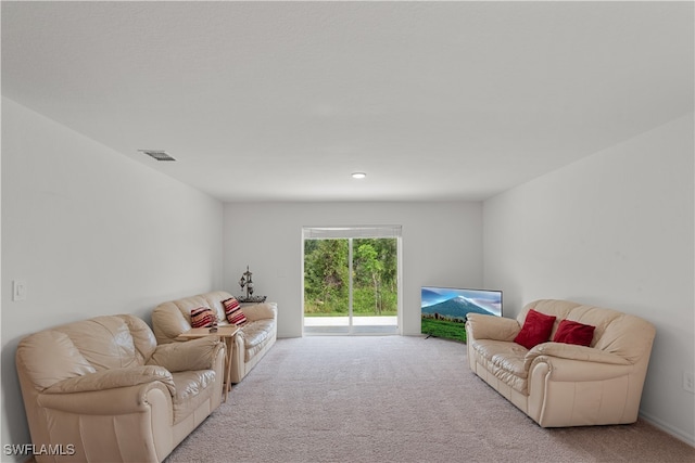 living room featuring light colored carpet