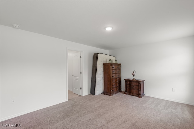 empty room featuring light colored carpet