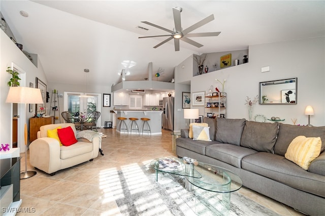 tiled living room featuring high vaulted ceiling and ceiling fan