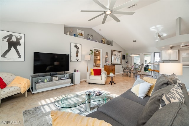 tiled living room featuring high vaulted ceiling and ceiling fan