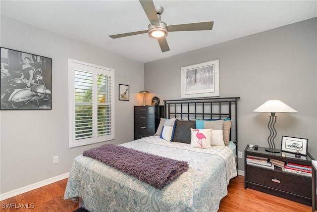 bedroom with ceiling fan and light hardwood / wood-style floors