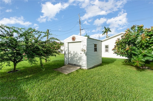 view of outbuilding with a lawn