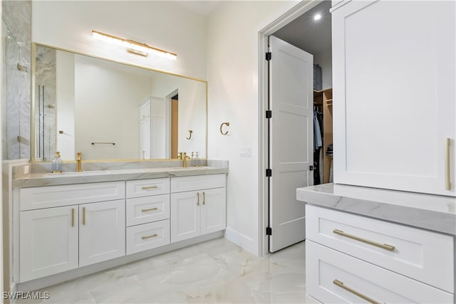 bathroom featuring vanity and an enclosed shower