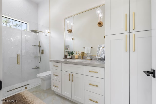 bathroom featuring vanity, toilet, and an enclosed shower