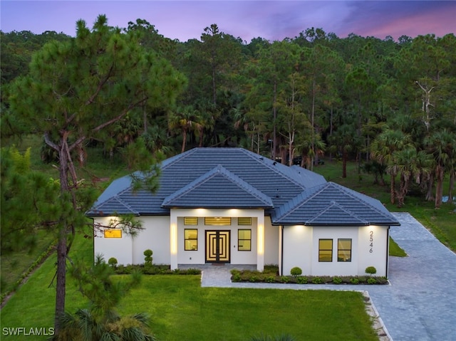 view of front of home with a lawn