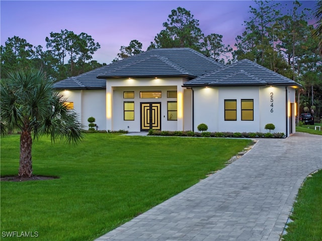 view of front of property with a lawn