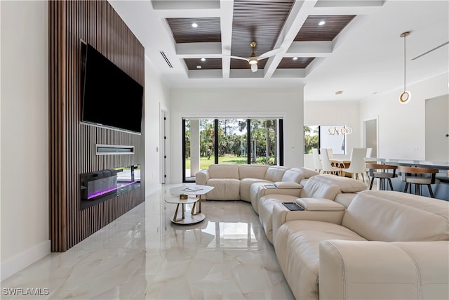 living room with coffered ceiling and beamed ceiling