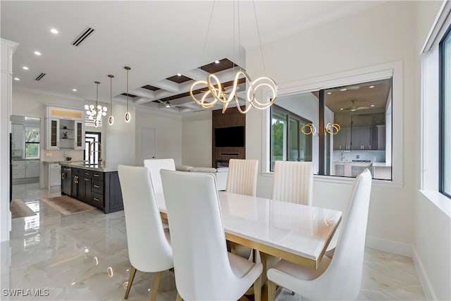 dining room featuring a notable chandelier and sink