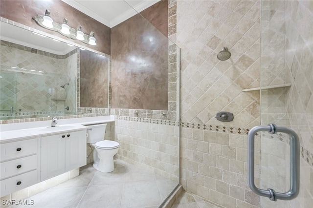 bathroom with an enclosed shower, tile walls, ornamental molding, vanity, and tile patterned flooring