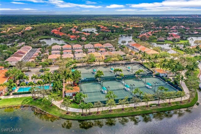 birds eye view of property with a water view