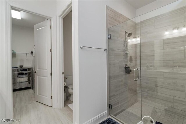 bathroom with toilet and walk in shower