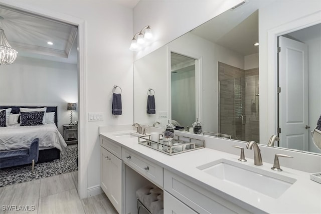 bathroom featuring vanity and a shower with shower door