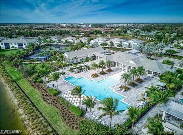 birds eye view of property with a water view