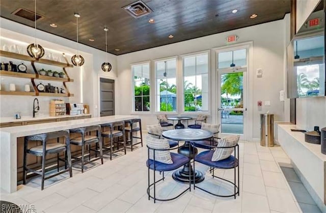 dining room with light tile patterned flooring and sink