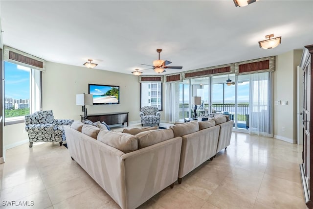 tiled living room featuring ceiling fan