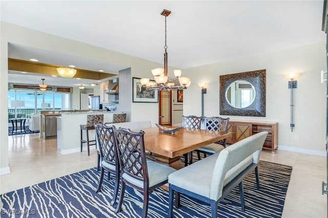 tiled dining area featuring a notable chandelier