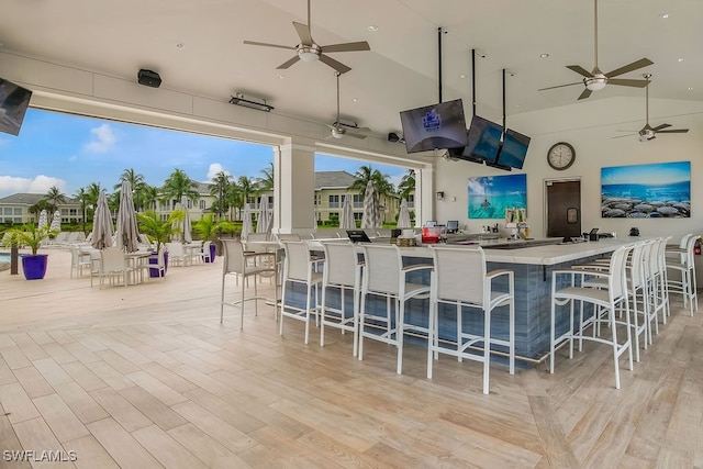 view of patio / terrace featuring ceiling fan and a bar