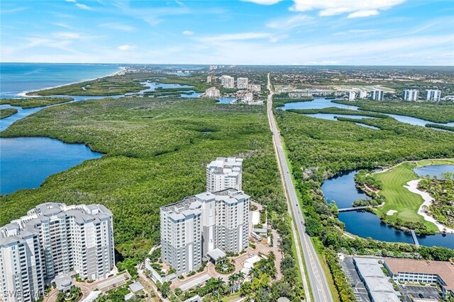 birds eye view of property featuring a view of city and a water view