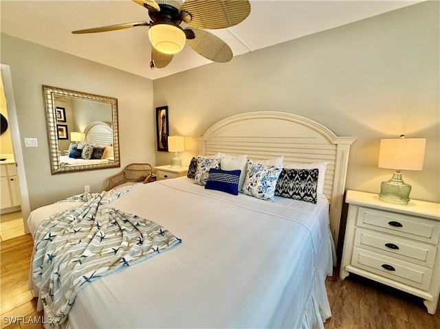 bedroom with ceiling fan and hardwood / wood-style flooring