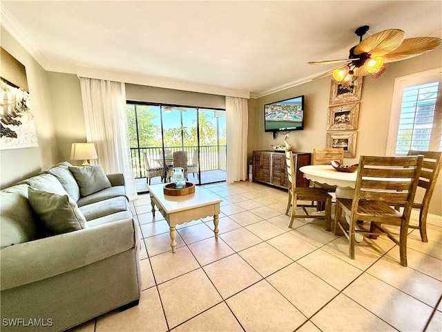 tiled living room with ceiling fan, ornamental molding, and a wealth of natural light