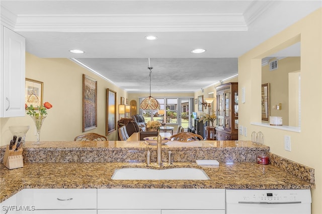 kitchen with crown molding, white dishwasher, sink, hanging light fixtures, and white cabinets