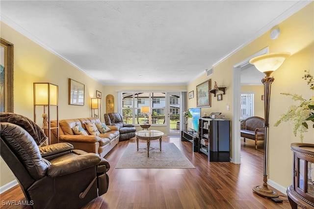 living room with ceiling fan, ornamental molding, and dark hardwood / wood-style flooring