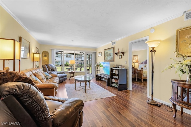 living room with ornamental molding and dark hardwood / wood-style flooring