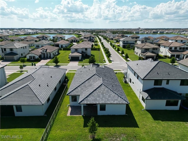 birds eye view of property with a residential view