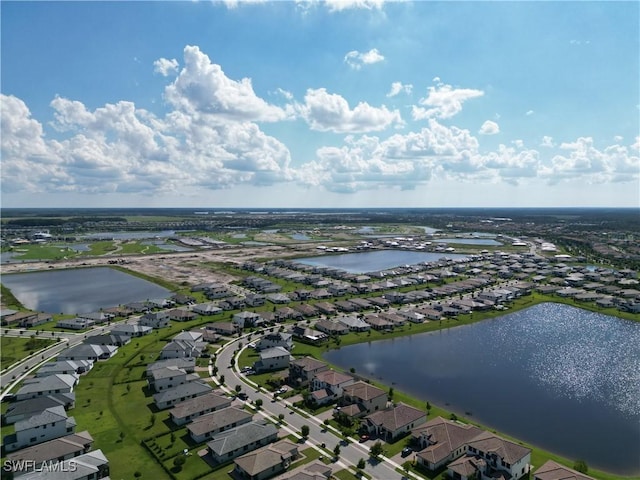 birds eye view of property featuring a residential view and a water view