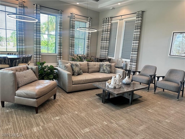 living area with carpet and recessed lighting