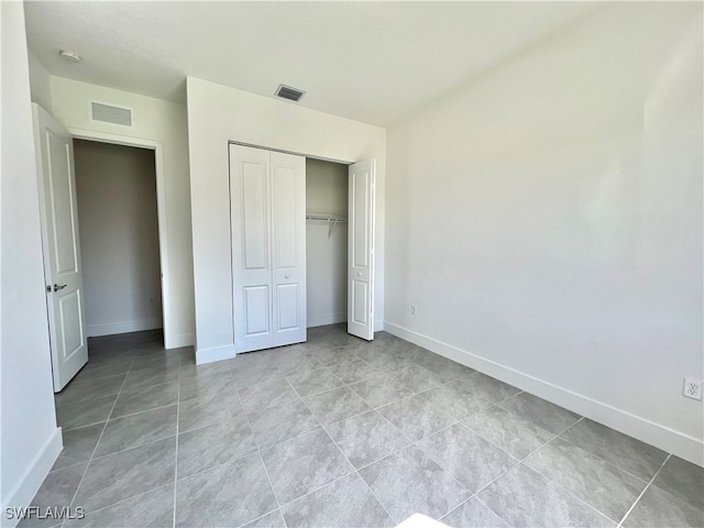 unfurnished bedroom featuring a closet