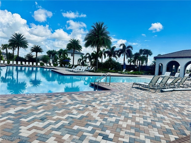 view of swimming pool with a patio