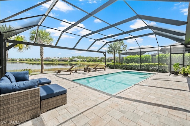 view of swimming pool with a water view, a lanai, and a patio area