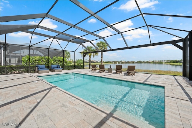 view of swimming pool featuring glass enclosure, a water view, and a patio