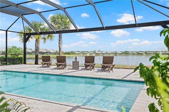 view of pool with a water view, a lanai, and a patio area