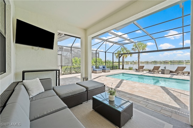 view of swimming pool with a patio area, an outdoor hangout area, glass enclosure, and a water view