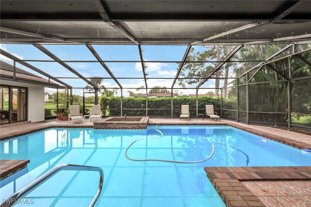 view of swimming pool with a lanai and a patio area