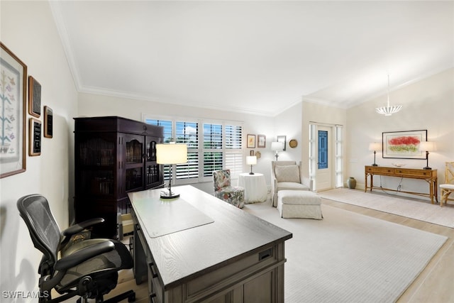 office featuring lofted ceiling, light wood-style floors, a notable chandelier, and crown molding