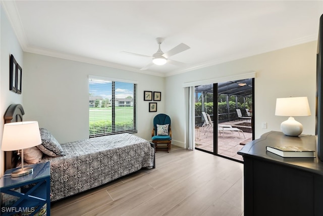 bedroom featuring access to outside, multiple windows, light wood-type flooring, and crown molding