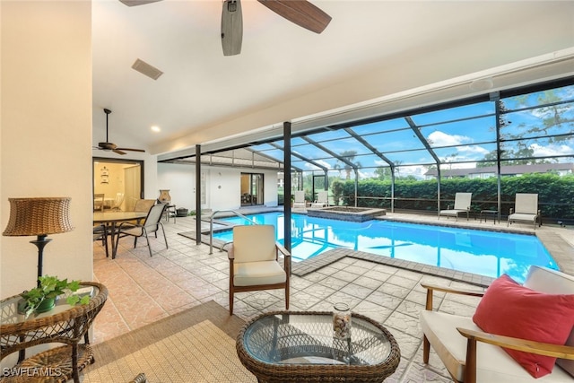 view of pool featuring a ceiling fan, a pool with connected hot tub, a lanai, and a patio